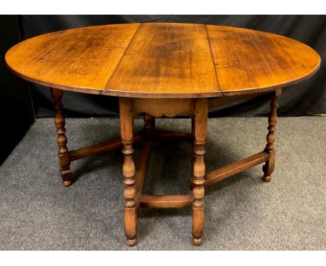 A Titchmarsh and Goodwin oak gate leg table, model RL8, 74cm high x 137cm wide (leaves open), 41cm (leaves closed) x 107cm de