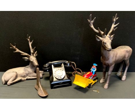 A Mid-century Bakelite telephone and metal toy tractor, decorative stags; etc 