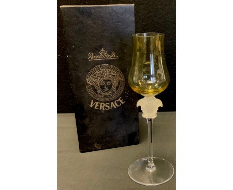 A Rosenthal Versace wine glass, yellow glass bowl, frosted Medusa-head stem, 21cm high, boxed 