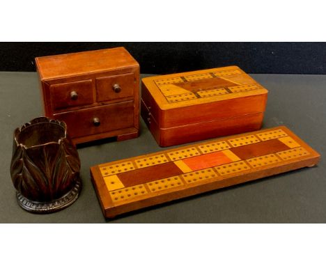A miniature chest of two short over single long drawers, 9.7cm high, 10.8cm wide, 6.2cm deep;  treen floral match holder;  cr