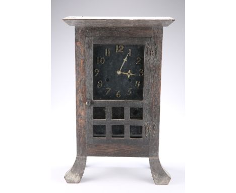 AN AMERICAN ARTS AND CRAFTS OAK MANTEL CLOCK, with two train movement, raised on splayed feet, New Haven Clock Company label.