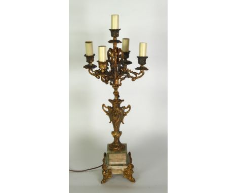 GILT METAL AND GREEN VEINED ONYX FIVE LIGHT FOUR BRANCH CANDELABRUM, with vase shaped column and scroll arms, on a stepped ob