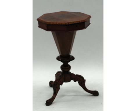 VICTORIAN FIGURED WALNUTWOOD AND CROSSBANDED SEWING TABLE, the quarter cut, octagonal top enclosing a compartmented interior,