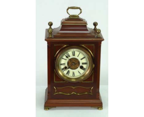 LATE NINETEENTH CENTURY MAHOGANY AND BRASS MOUNTED MANTEL CLOCK, in the Georgian style, the 4 1/2" Roman dial with gilt scrol