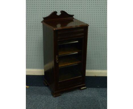 EARLY TWENTIETH  CENTURY MAHOGANY MUSIC CABINET, the moulded oblong top with swan neck pediment style low back and serpentine