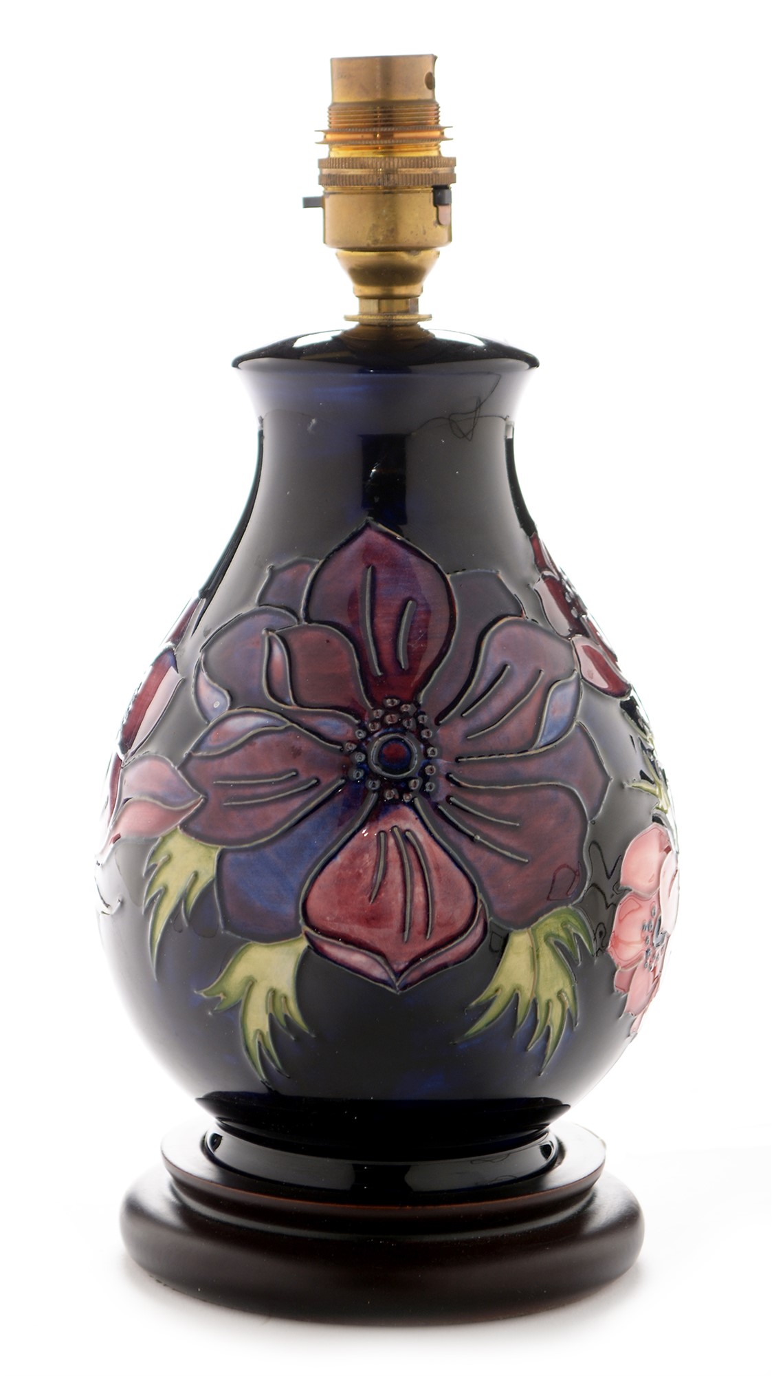 A modern Moorcroft poppy design lamp base, dark blue ground, with ...