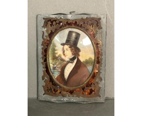 A miniature portrait of a young man in a lead frame with brass and tortoiseshell inlay 