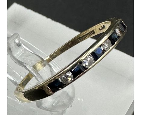 A 9ct gold diamond and sapphire ring, approximate size R.