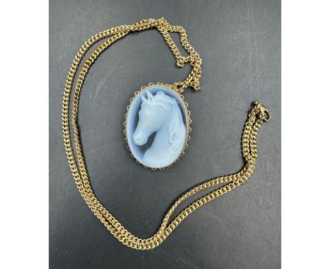 A 9ct gold chain with 9ct gold pendant, cameo style of a horses head. (Approximate weight of necklace 9.3g and approximate we