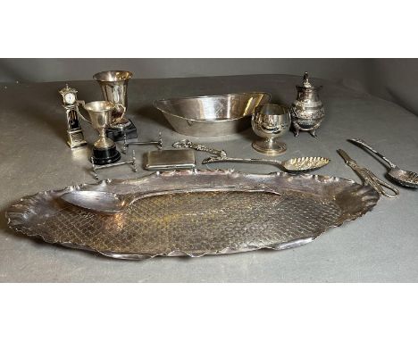 A quality selection of silverplated items to include a fish scale tray, knife rests, berry spoons, grape scissors, goblets, c