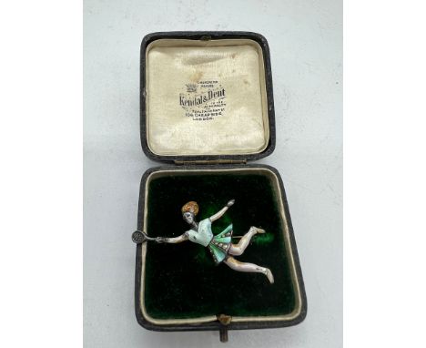 A silver and enamel tennis player brooch  (5.5cm)