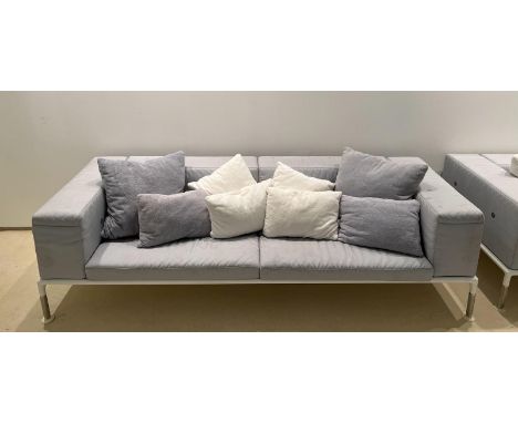 A grey outdoor sofa by B &B Italia outdoor spring time (H73cm W260cm D97cm)