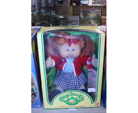 A vintage boxed Cabbage Patch doll 