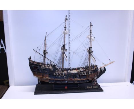 A large wooden model of 'The Black Pearl' pirate ship, shipping unavailable 