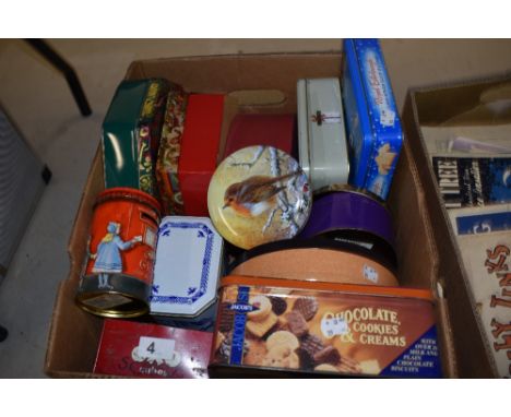 A selection of vintage tins and boxes, some Christmas themed.