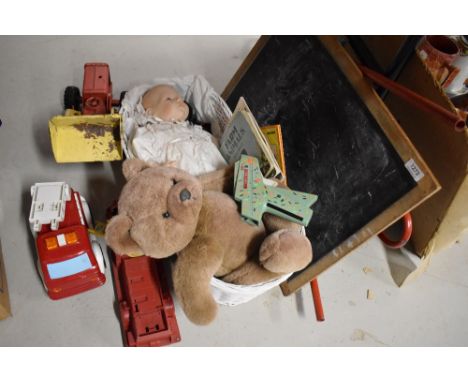 A shelf of vintage Toys including Triang Blackboard, Loading Shovel and plastic Fire Engine etc