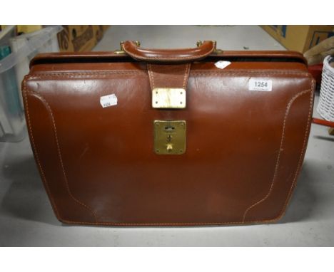 A vintage gentlemans attaché case with tartan fabric interior. size 18'x13'x8' approx.