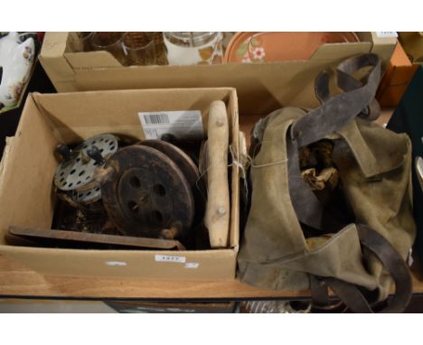 A canvas bag and a box of vintage fishing tackle and reels.