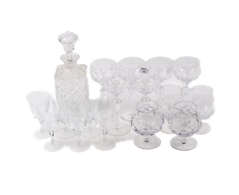 An assortment of glassware items. Comprising a decanter, six goblets, four wine glasses and four brandy glasses, Max. H122cm