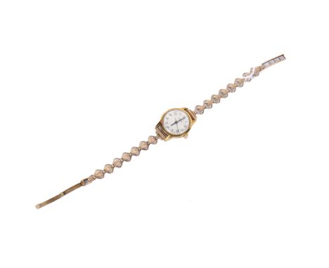 A vintage Roamer lady's wristwatch. With black Arabic numerals to the silvered face, yellow metal case diameter 2.1cm, on a h