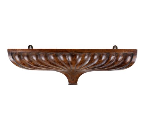 Carved laminated wood hanging shelf. Of rectangular form with fluted decoration. H17cm x W53cm x D13cm