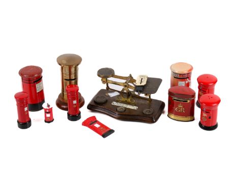Collection of red Postbox related items and a set of postal scales. Including money boxes, etc. Max. H12cm