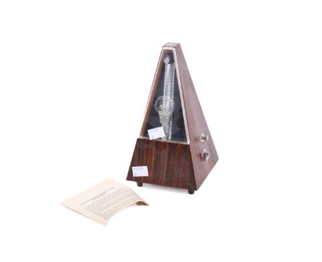 A vintage German metronome. In the original packaging, H24cm