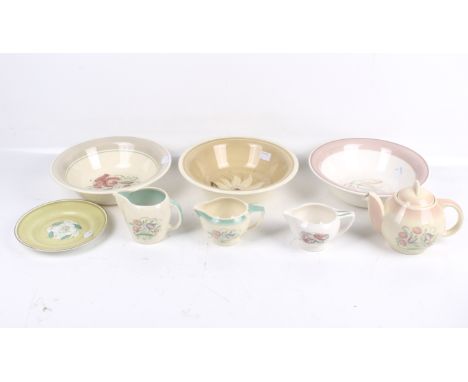 An assortment of mid-century Susie Cooper ceramics. Comprising six Burslem pieces including a teapot, three jugs and two dish