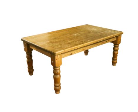 Vintage rectangular pine kitchen table. Raised on turned tapering supports. H77cm x W182cm x D106cm Condition Report: Appeare