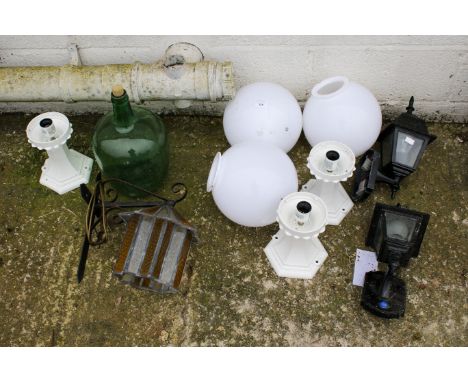 A quantity of garden lanterns and other items. Comprising two black and three white lanterns, the white with plastic bulb sha