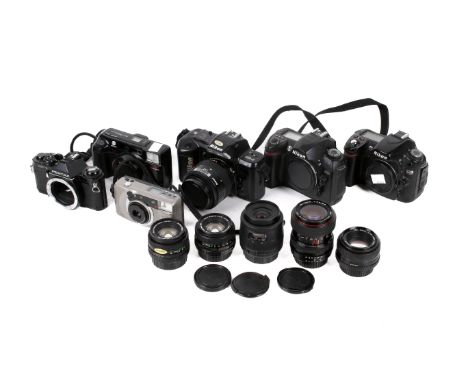 Box of assorted vintage film and digital cameras and lenses. Including Pentax MV1, Nikon D70s, etc.