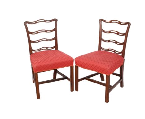 A pair of Georgian style mahogany ladder back chairs. With burgundy upholstered seats. H93cm