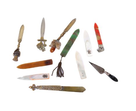 Eleven assorted vintage bookmarks. With finials in the form of a thistle, an acorn, white metal elephant, three of mother-of-