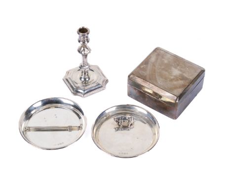 Five pieces of silver. Including a small weighted candlestick, a wood lined cigarette box, a cocktail stirrer, and a pair of 