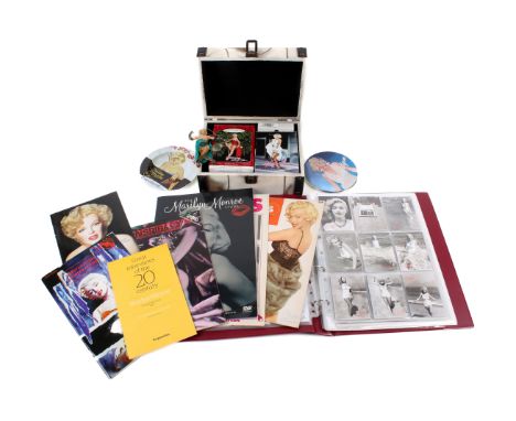 A mixed collection of Marlyn Monroe related items. Including CD, Zippo lighter, etc. 