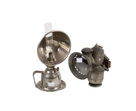 A vintage bike lamp and an oil lamp. Both having cast metal frames, H25cm