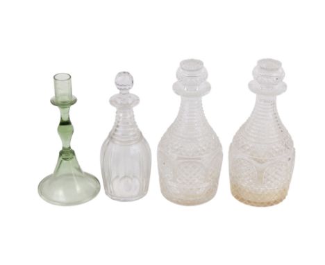 Three glass decanters and a glass candlestick. Max. H26cm