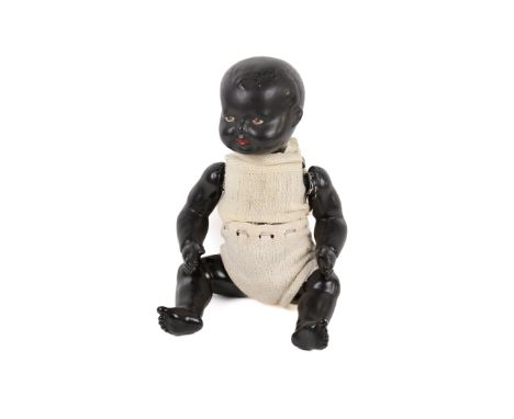 A vintage doll. Having painted features, dressed in knitted clothing, L47cm