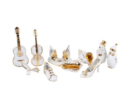 Ten assorted porcelain and crystal Limoges and Swarovski ornaments. Including shells, shoes and a guitar, etc. Factory marks 