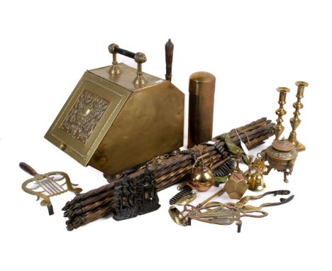 An assortment of brassware. Including stair rods, a coal box, pair of candlesticks, fire tools, etc. 