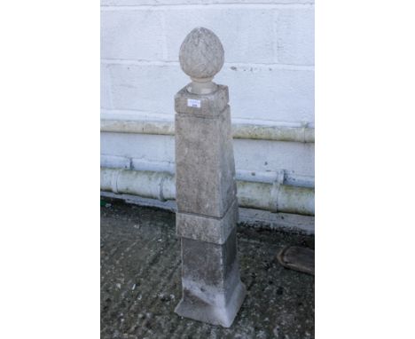 Stone garden feature obelisk of square form with a pineapple finial. H96cm