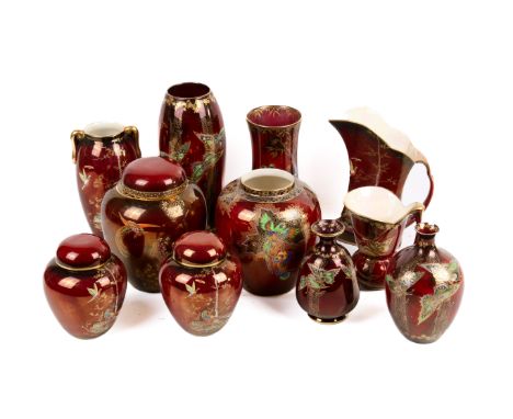 Eleven pieces of Crown Devon red lustre ware. Including a pair of ginger jars, jugs and vases. Max. H22cm