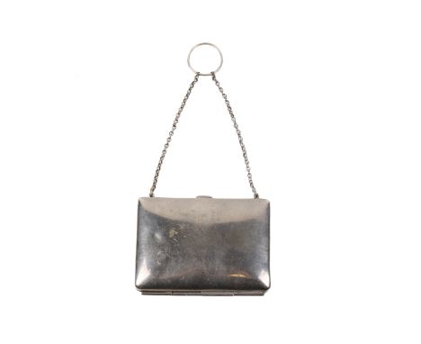 A vintage silver plated coin purse and chain. Of rectangular slightly convex form, undecorated, on a short chain and ring. 8c