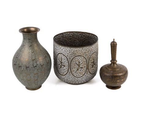 Three Persian decorative brass vessels. Including a vase and a planter, etc. Max. H35cm