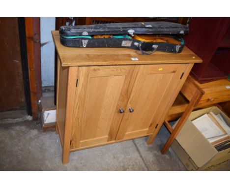A light oak side cupboard 