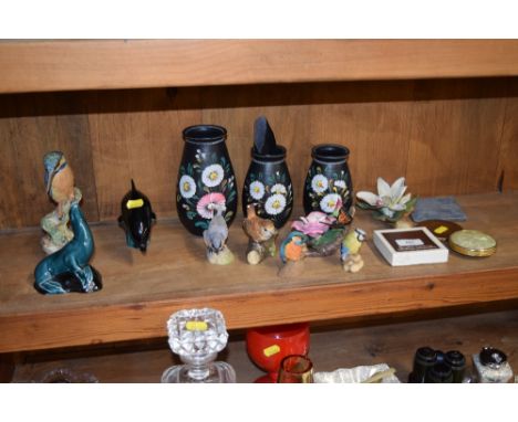 A collection of various bird ornaments, four compacts, a Poole pottery dolphin and seal etc.