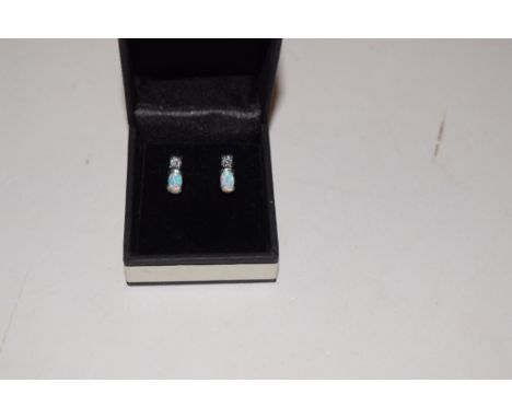 A pair of silver and opal set ear-rings 