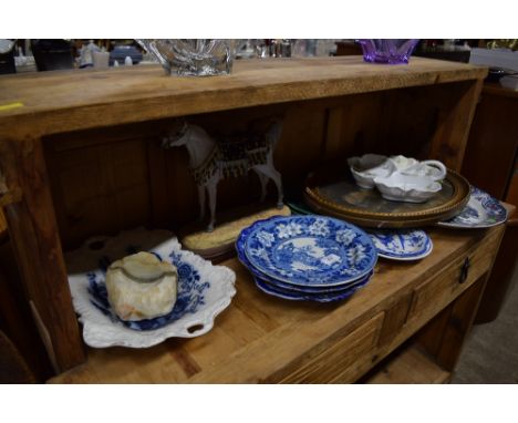 A horse ornament; a 19th Century gilt framed oval print; two green glazed leaf plates; blue and white china etc. 