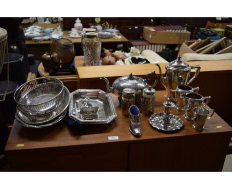 A quantity of silver plated ware to include a three piece coffee set, teapot, pin cushion, chamber stick, entree dish etc
