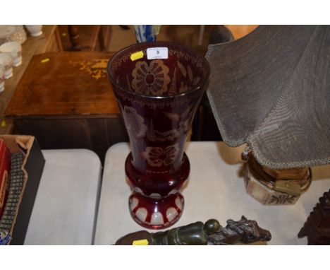 A tall Bohemian ruby glass vase